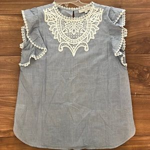 Blue tank with white embroidery and ruffle sleeve